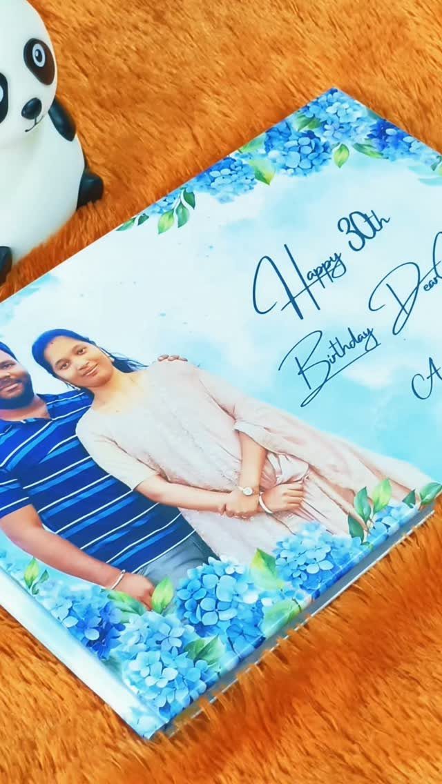 Personalized 30th birthday photo album cover with a couple and blue flowers.