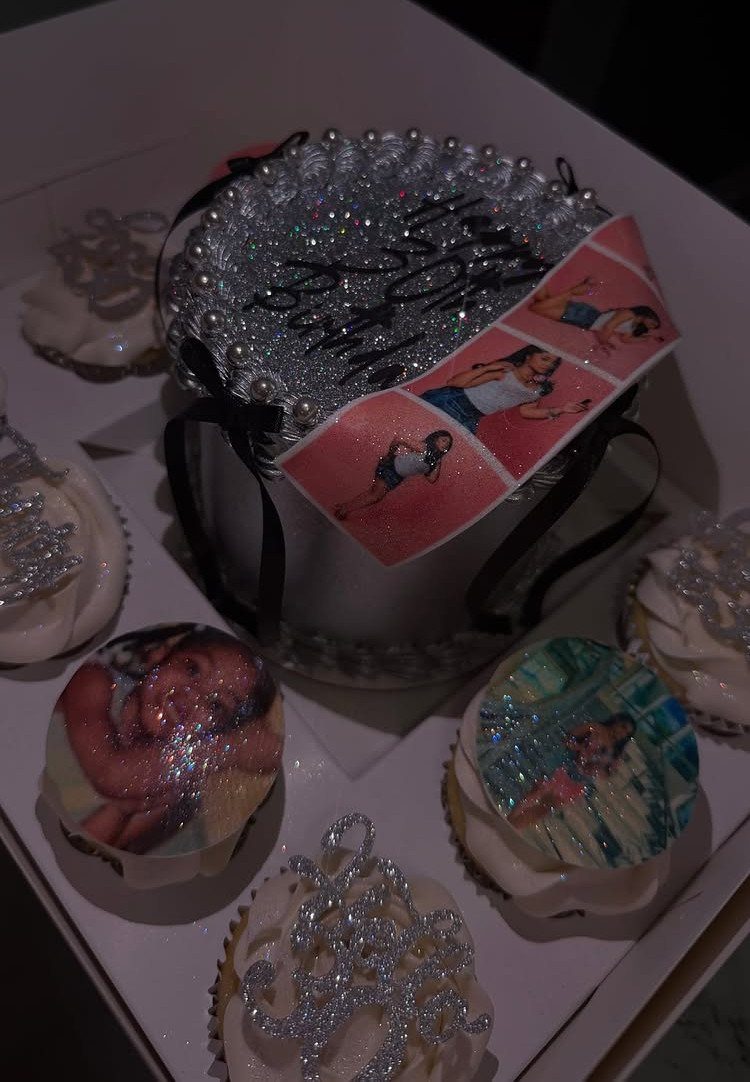 Silver glittery birthday cake and cupcakes with edible photos of a woman.