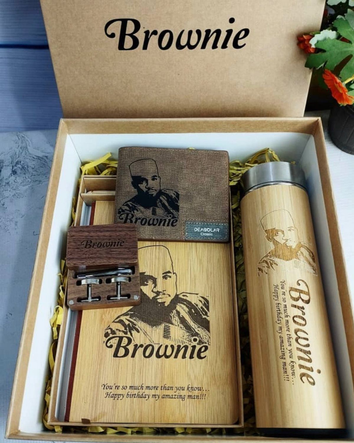 Personalized gift set with bamboo bottle and notebook engraved with portrait and name.