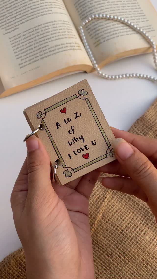 Handmade A to Z of why I love you booklet held by hands