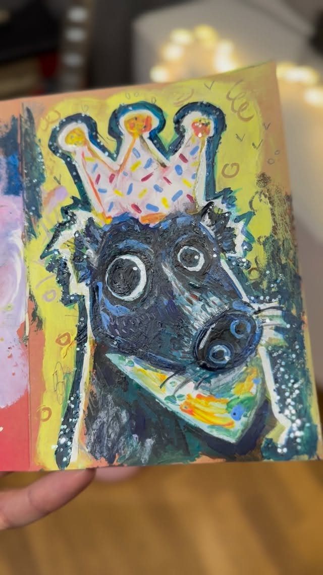Hand-painted portrait of a black dog wearing a colorful crown on yellow background