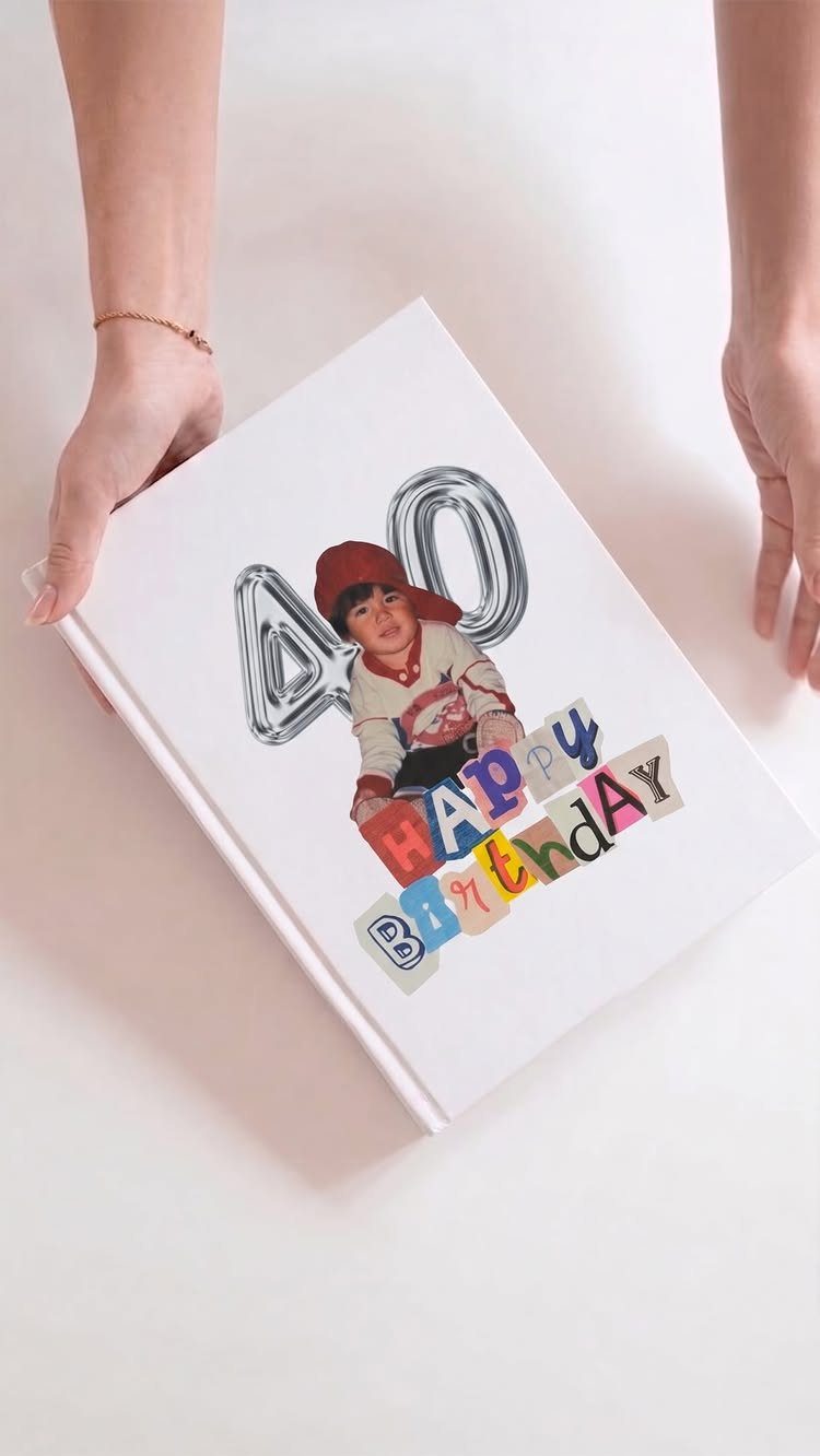 White personalized photo book cover featuring a child's photo and number 40 balloons.