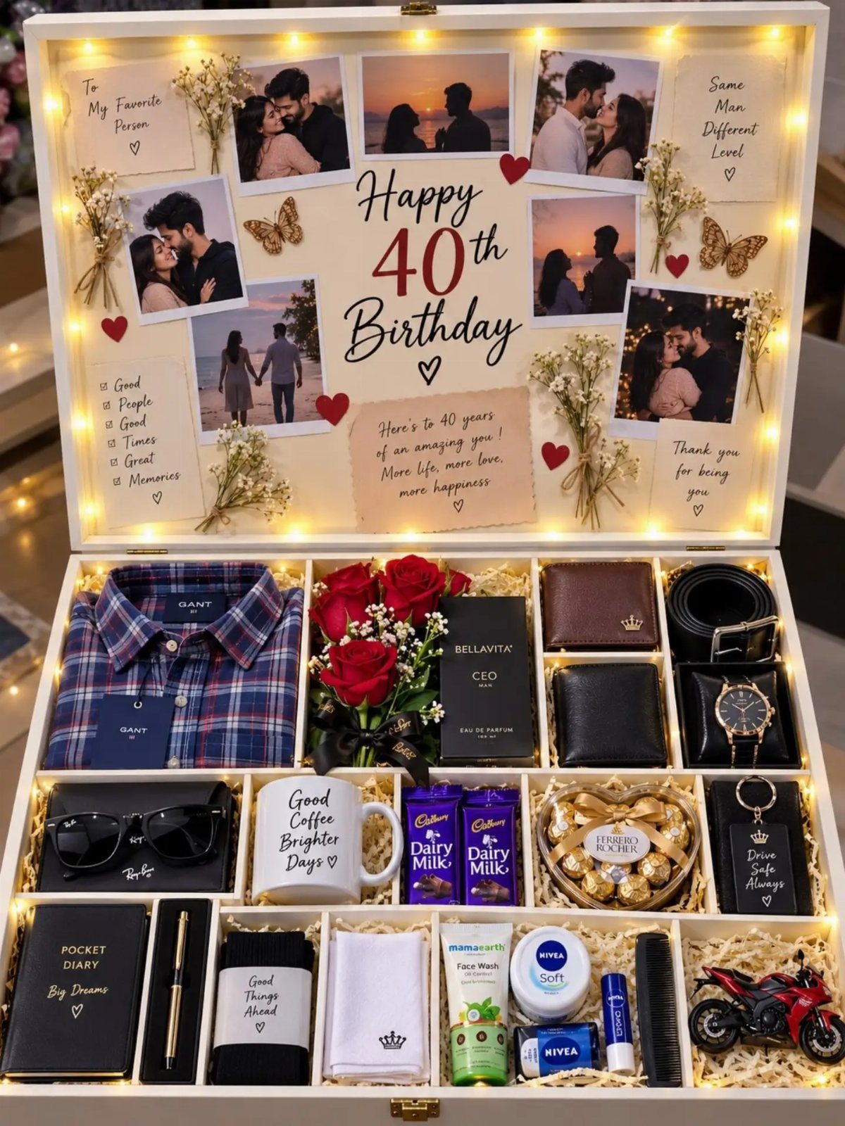 Open white gift box for a 40th birthday containing various men's accessories and photos.