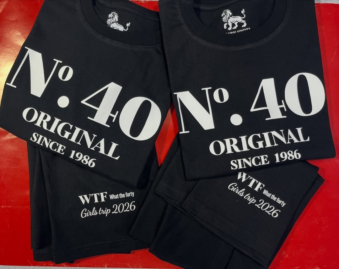 Black t-shirts with white text celebrating a 40th birthday and girls trip.