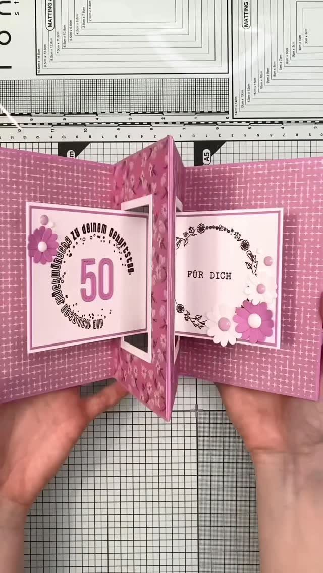 Pink 3D birthday card with floral elements and the number 50.