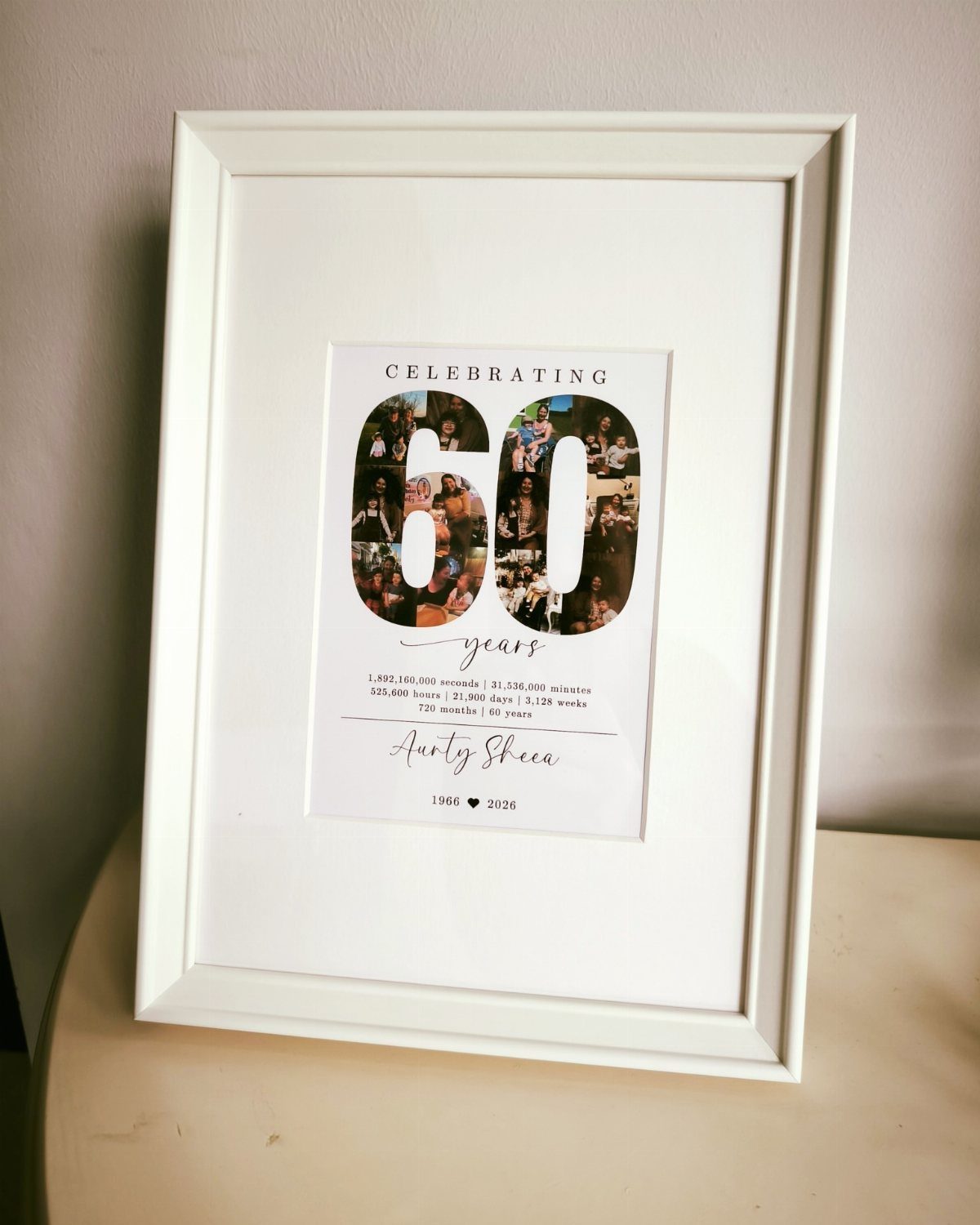 Framed 60th birthday wall art with a photo collage inside the number 60.