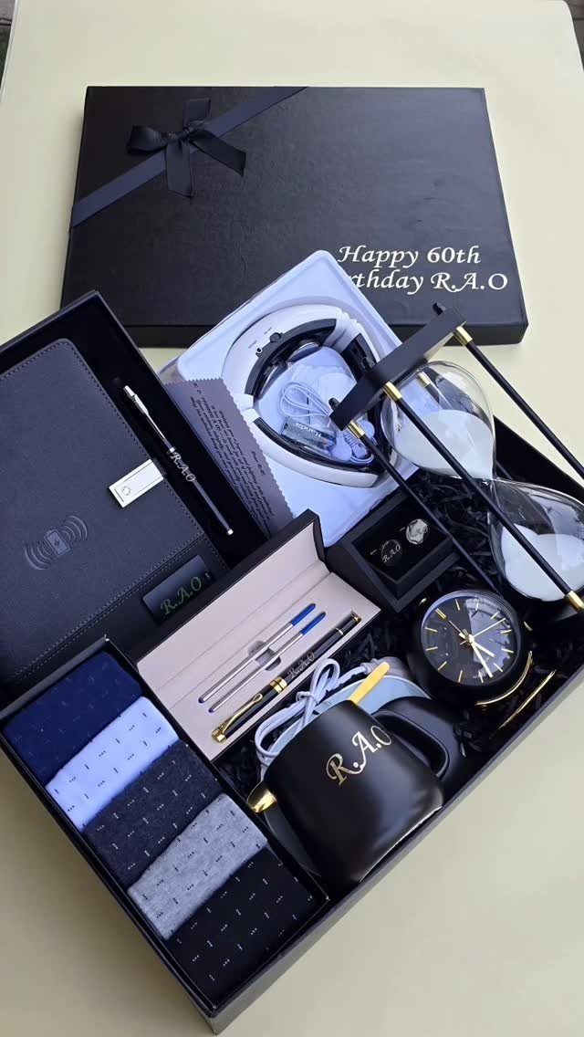 Men's 60th birthday gift set with wallet, watch, earbuds, and whiskey glasses in box