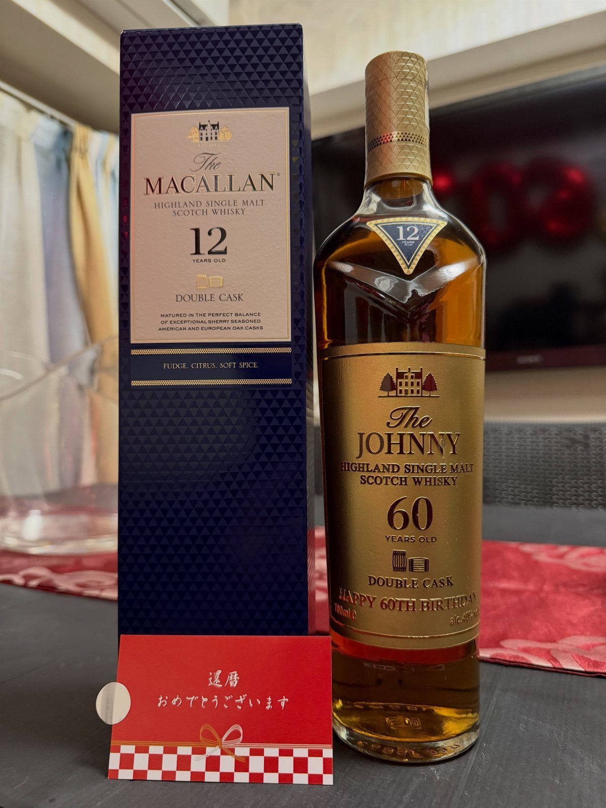 Personalized bottle of scotch whisky and blue box for a 60th birthday gift.