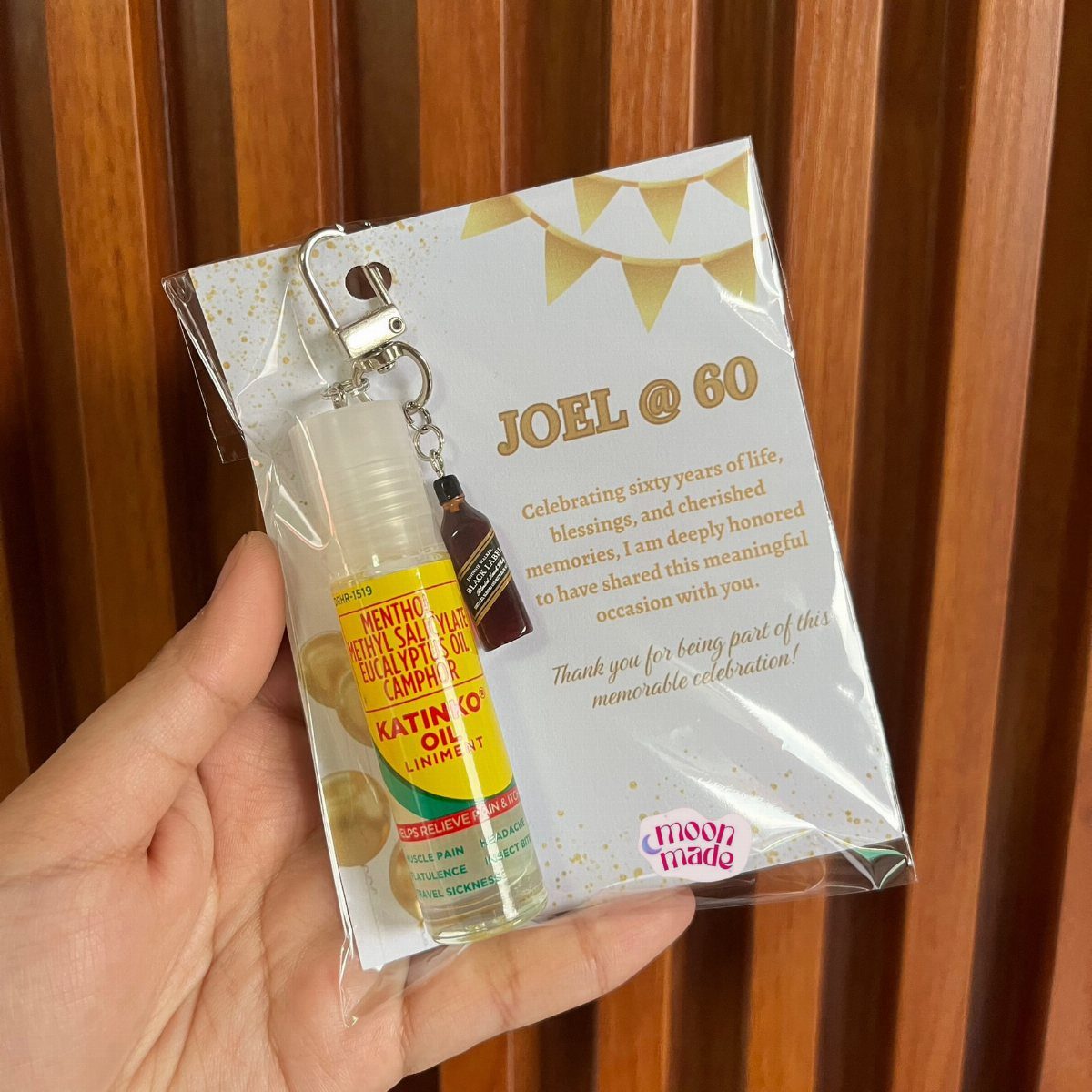 Birthday favor bag for Joel's 60th birthday containing small essential oil bottles.