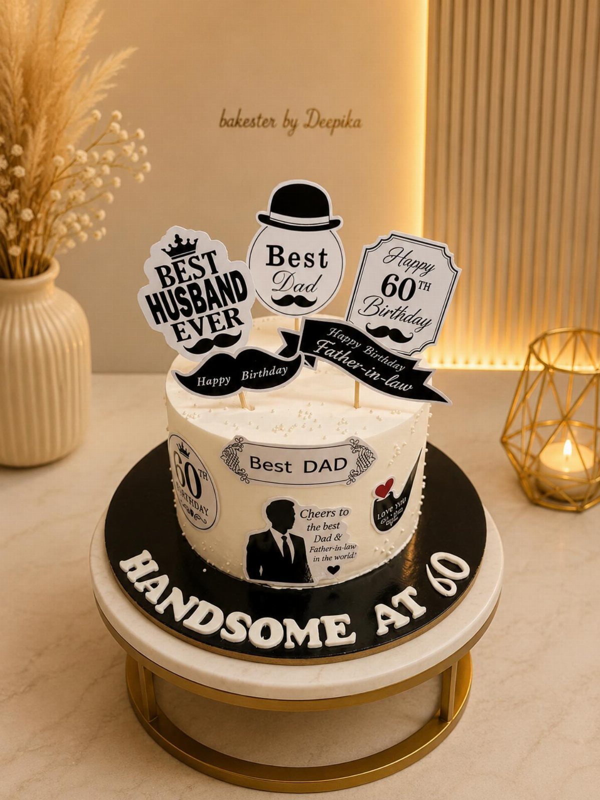 White 60th birthday cake for a husband and father with themed toppers.