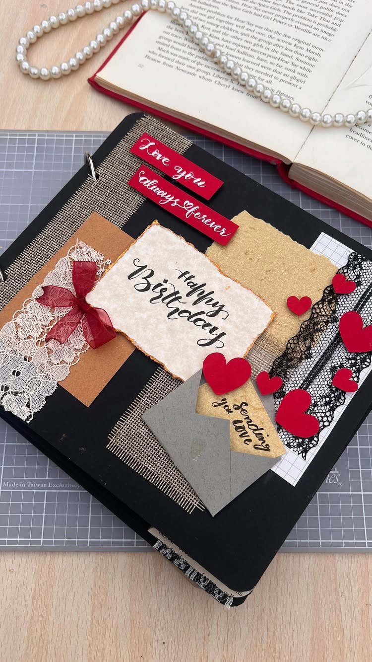 Handcrafted birthday scrapbook page with red hearts, lace, and a Happy Birthday card.