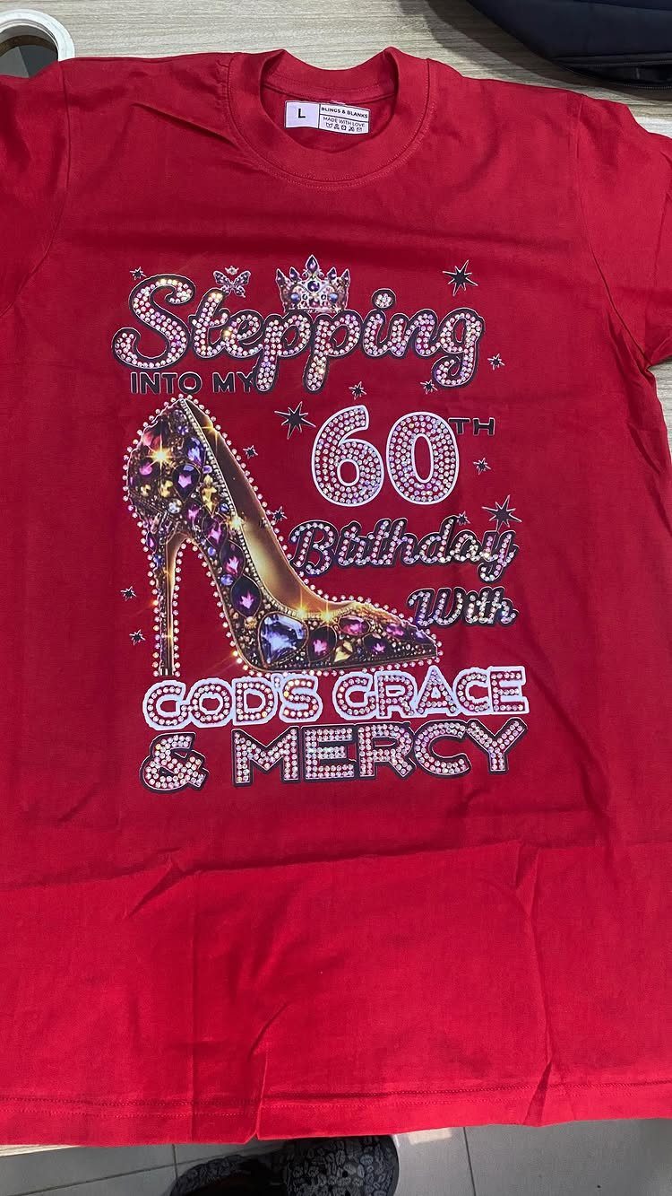Red t-shirt with rhinestone 60th birthday design featuring a high-heeled shoe