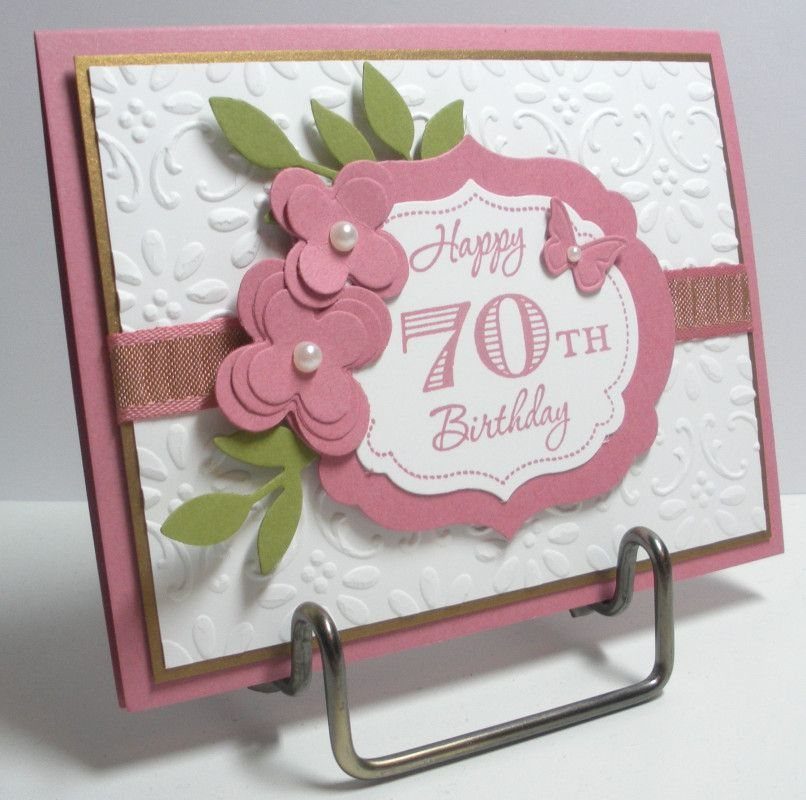 Handmade 70th birthday card with pink paper flowers and a scalloped frame.