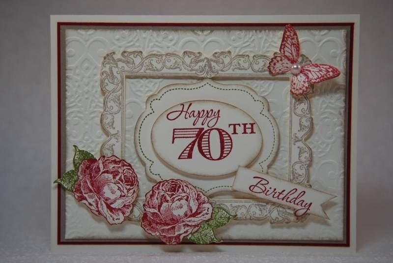 70th birthday card with red roses, a butterfly, and vintage style lettering.