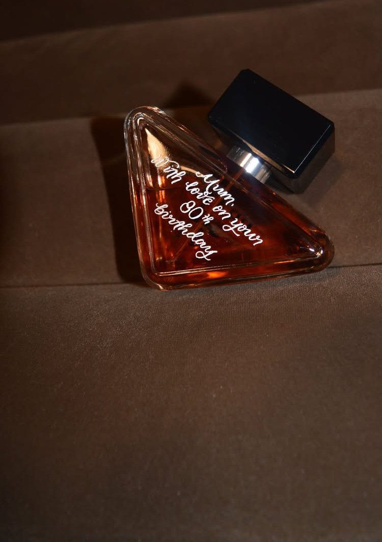 Triangular perfume bottle engraved with a message for a mum's 80th birthday.