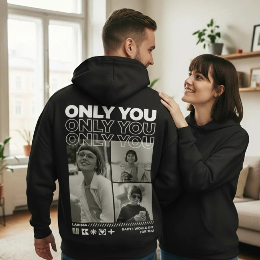 Couple wearing black hoodies with a personalized photo collage on the back.