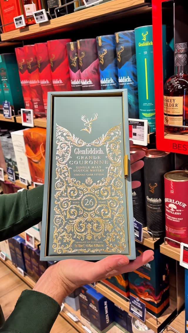 Glenfiddich 26-year-old single malt scotch whisky in a decorative gold and blue box.