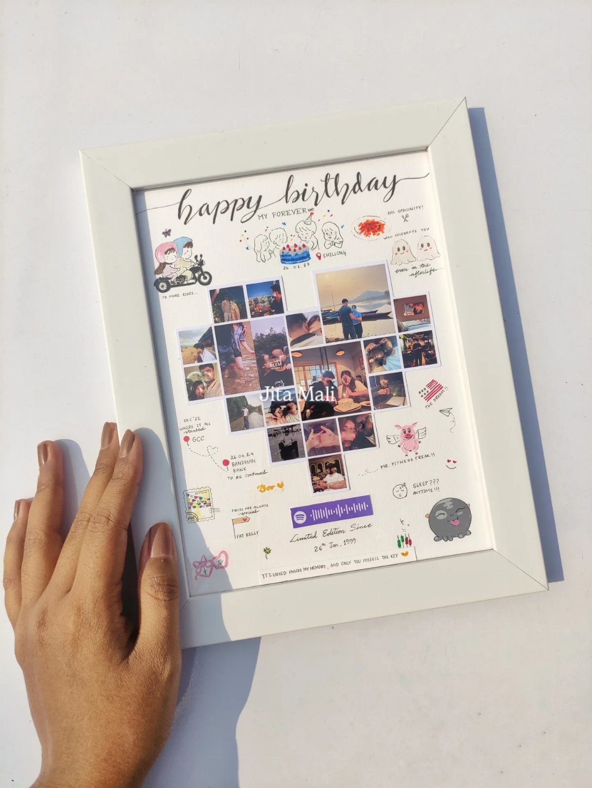 Framed birthday collage with small photos, handwritten notes, and colorful doodles.
