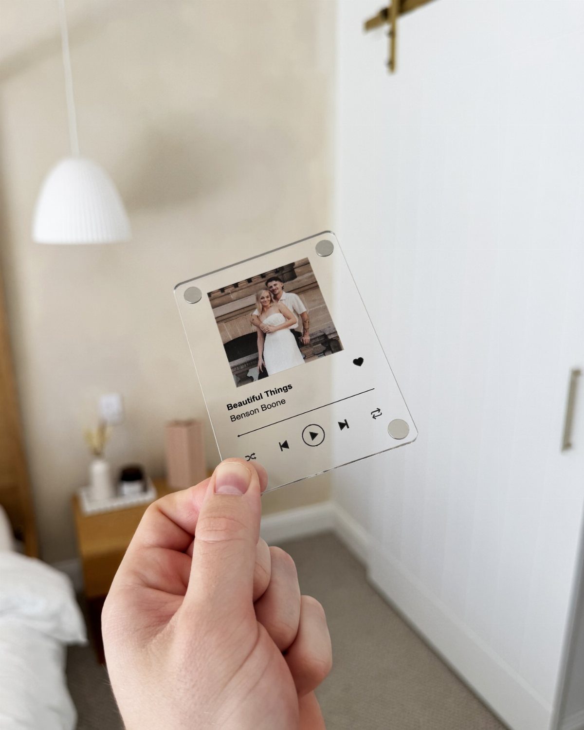 Customized Spotify acrylic plaque featuring a couple's photo and song playback controls.