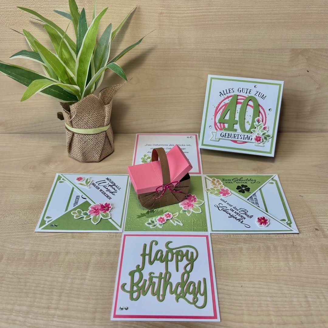Handmade explosion box with pink and green panels, a small basket, and 40th birthday card.