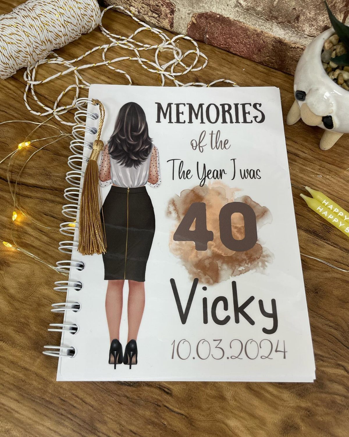 Personalized 40th birthday journal for Vicky with a woman illustration and gold tassel.