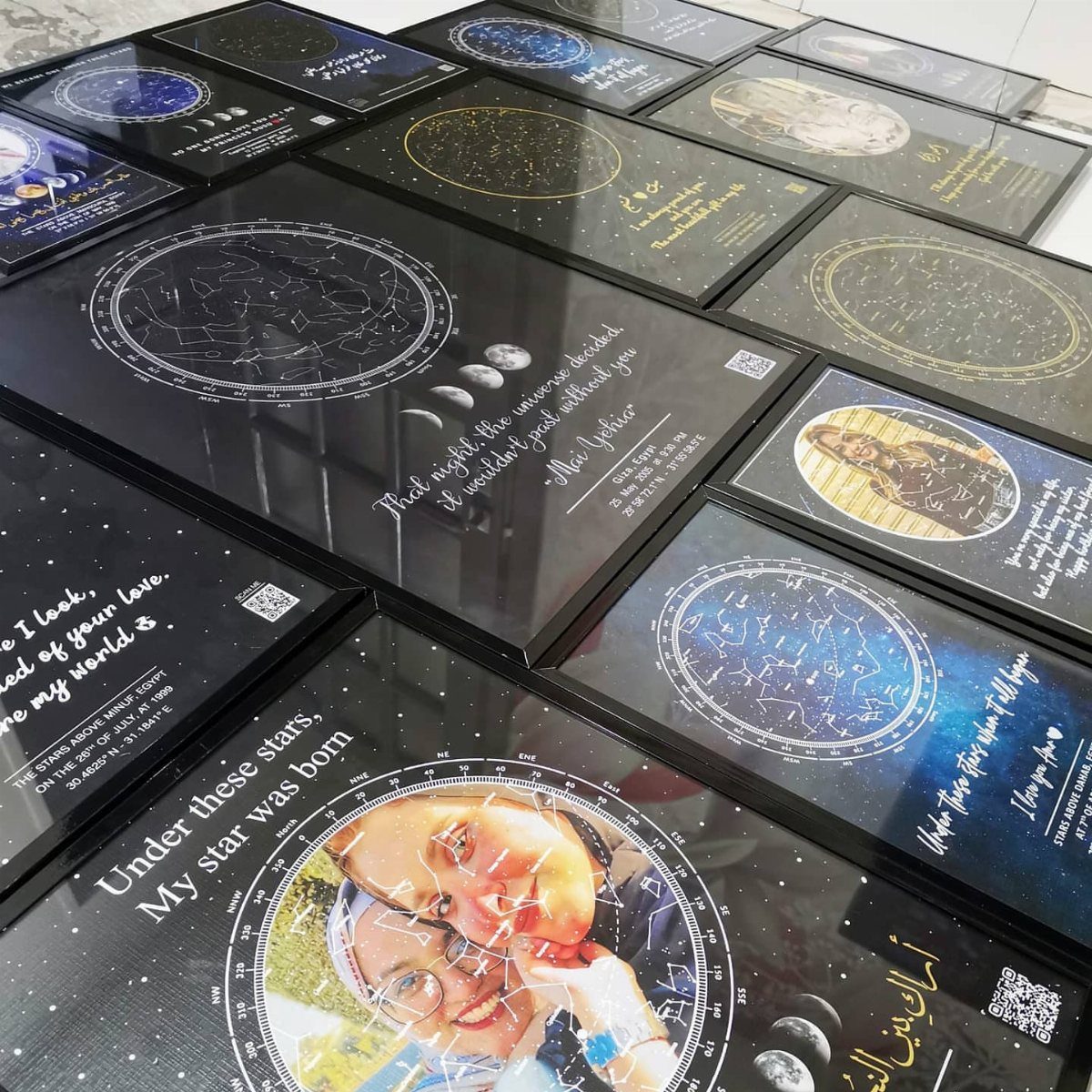 Personalized star map plaques with celestial diagrams and photos on a white surface