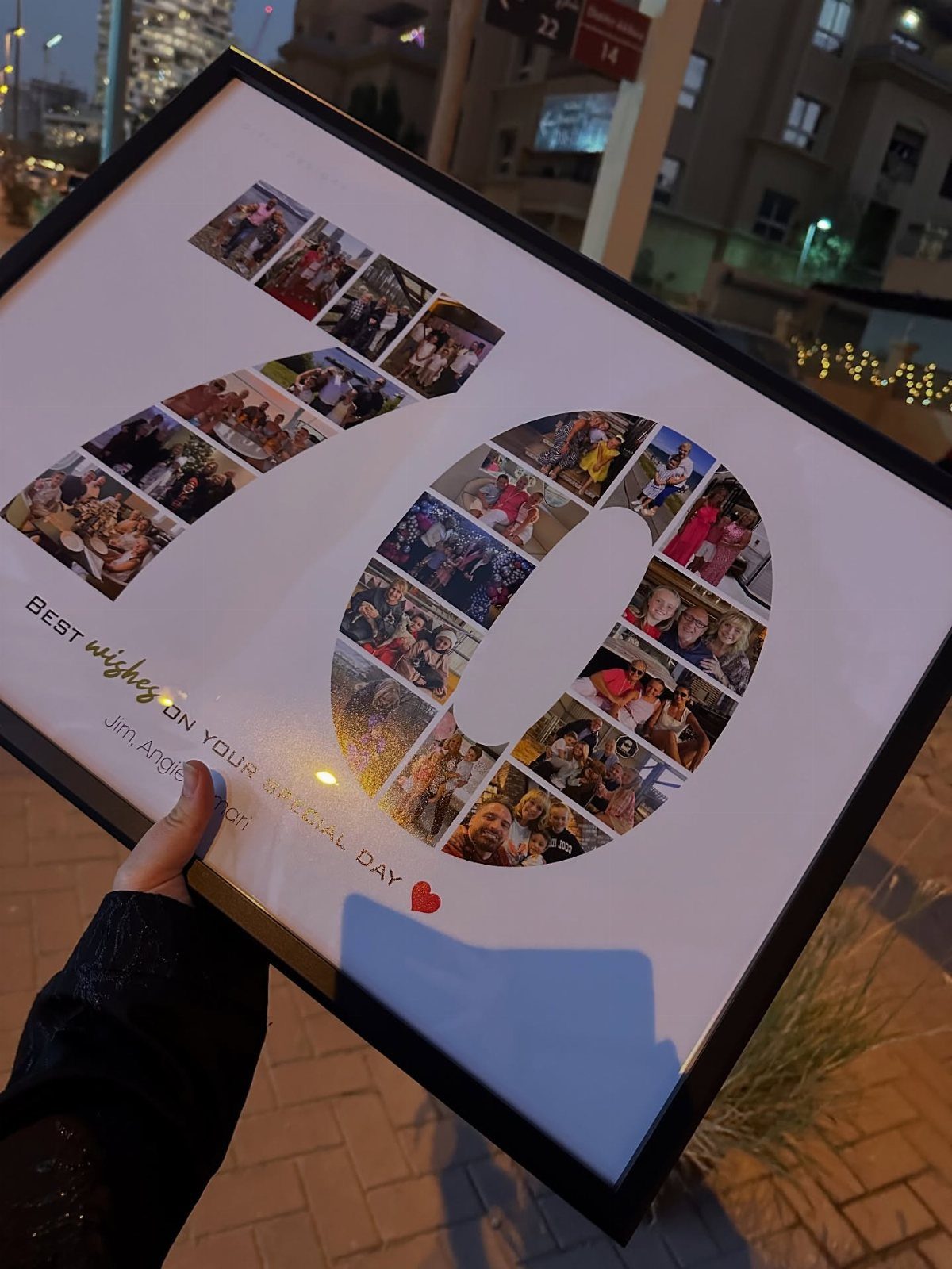 Framed photo collage forming the number 70 with birthday wishes and a heart.