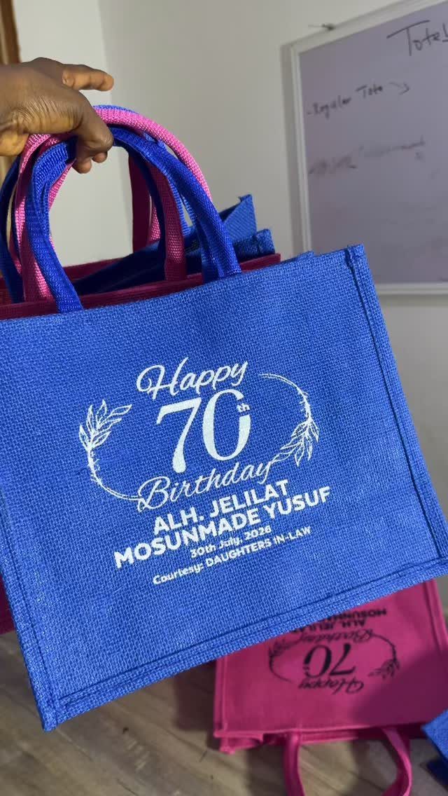 Blue personalized tote bag celebrating a woman's 70th birthday with white printed text.