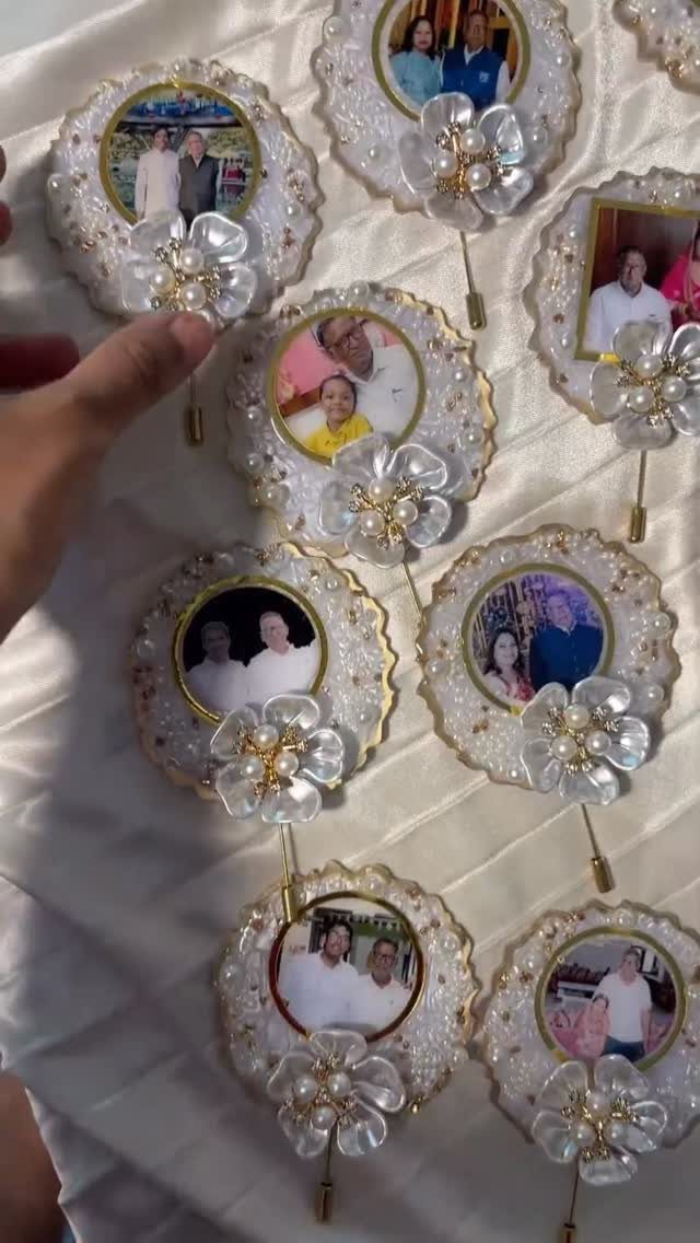 Small circular white decorative frames containing family photographs with floral embellishments.