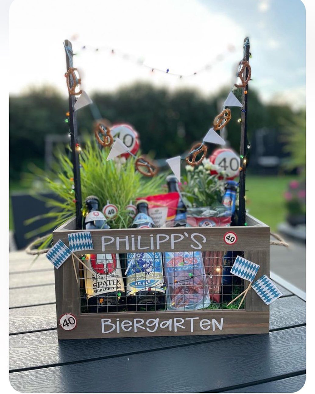 Beer gift basket in a wooden crate labeled Philipp's Biergarten for a 40th birthday.